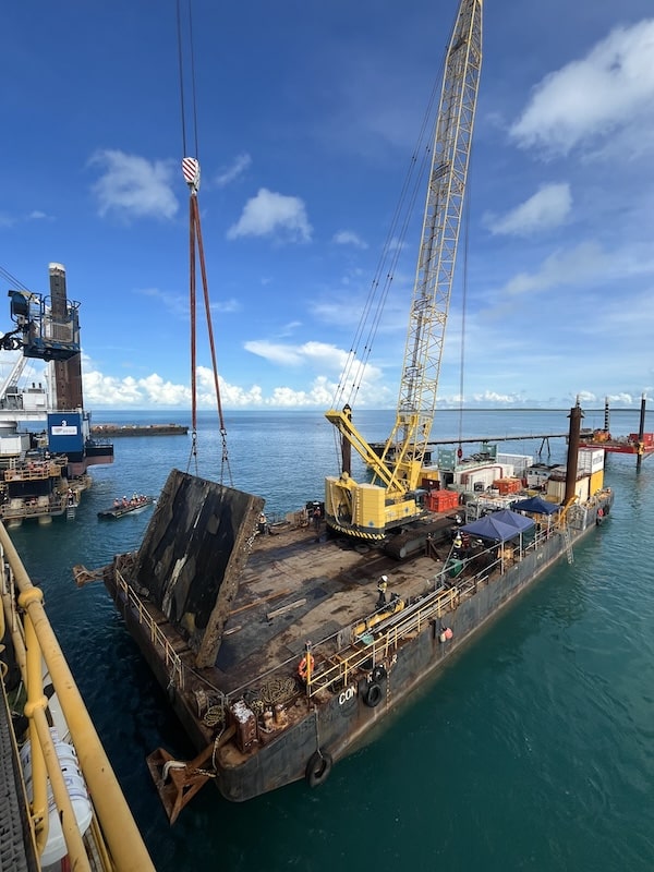 Marine plant operated in close proximity around the structure, requiring careful coordination.