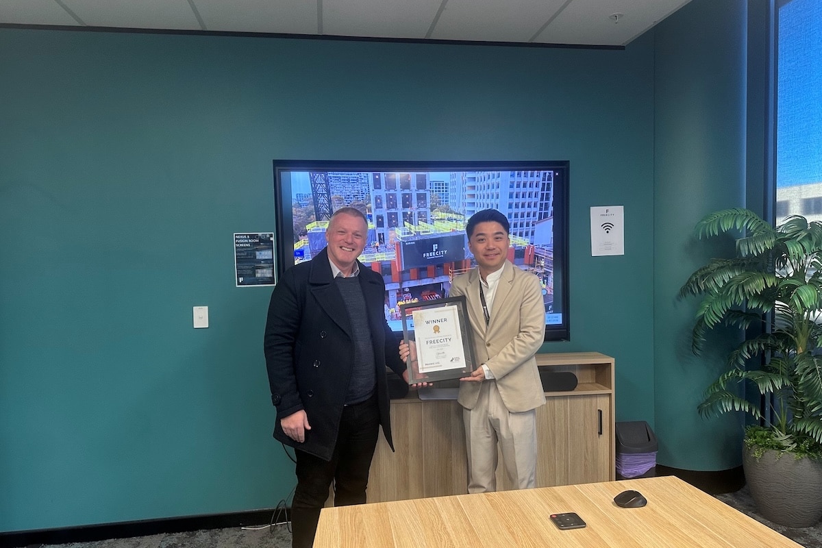 NAWIC’s Greg Belle and Freecity Construction’s Lawrence Zheng celebrated the win.