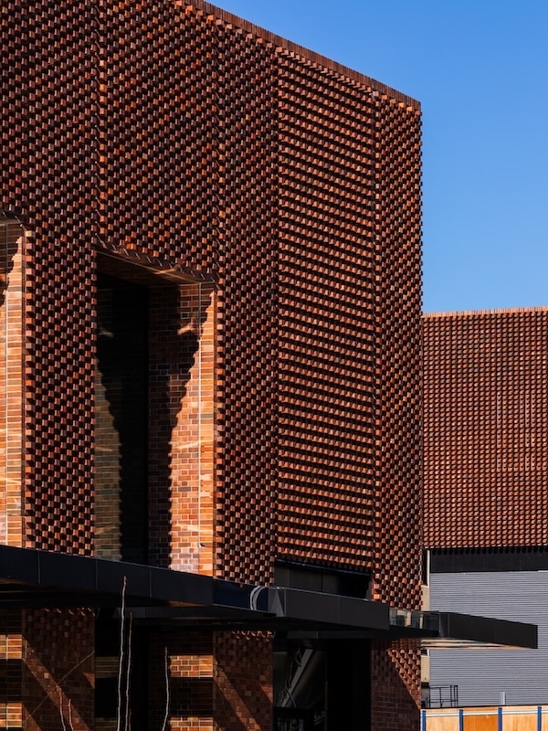 The façade draws inspiration from the area’s historic brick buildings. (Image: Trevor Mein)